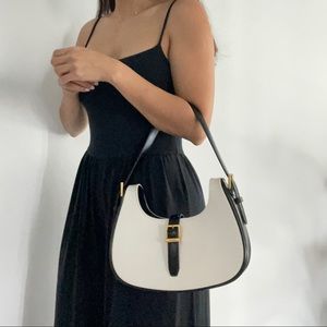 Saint Laurent hobo Le Fermoir bag in back and white leather